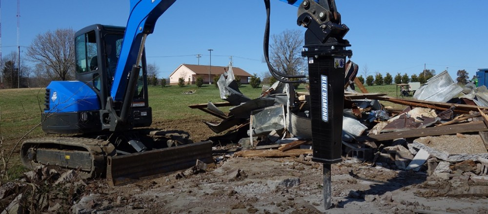 Blue diamond breaker attachment on skid steer