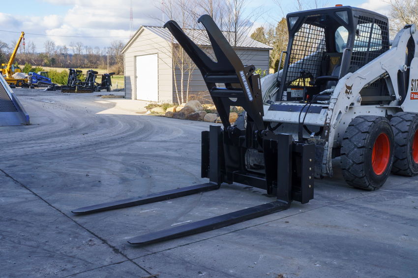 Blue diamond hydraulic adjusting pallet fork attachment for skid steer